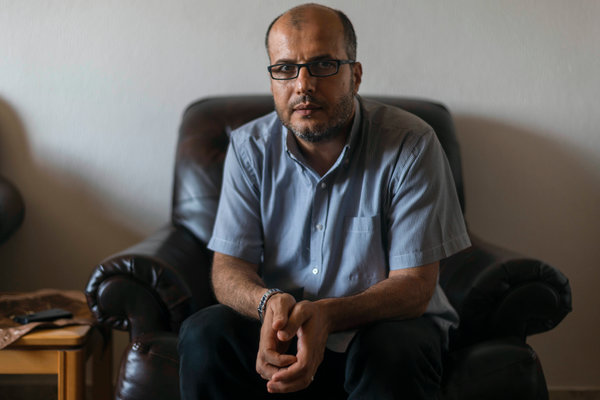 Hassan al-Zeyada, a psychologist who works at the Gaza Community Mental Health Program, at his home in Gaza. Credit Sergey Ponomarev for The New York Times 